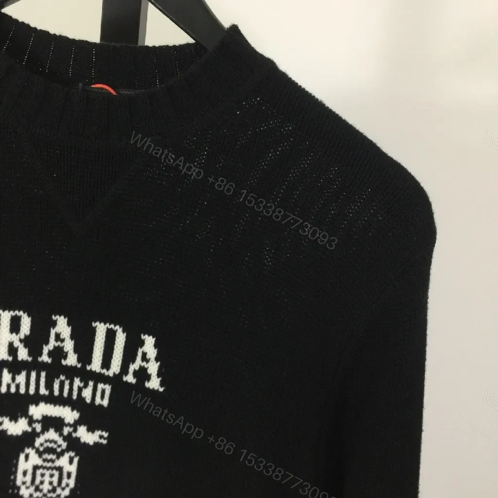 View 4 of Leather-Feel Knit Crewneck with Crest: Subtle Luxury Comfort