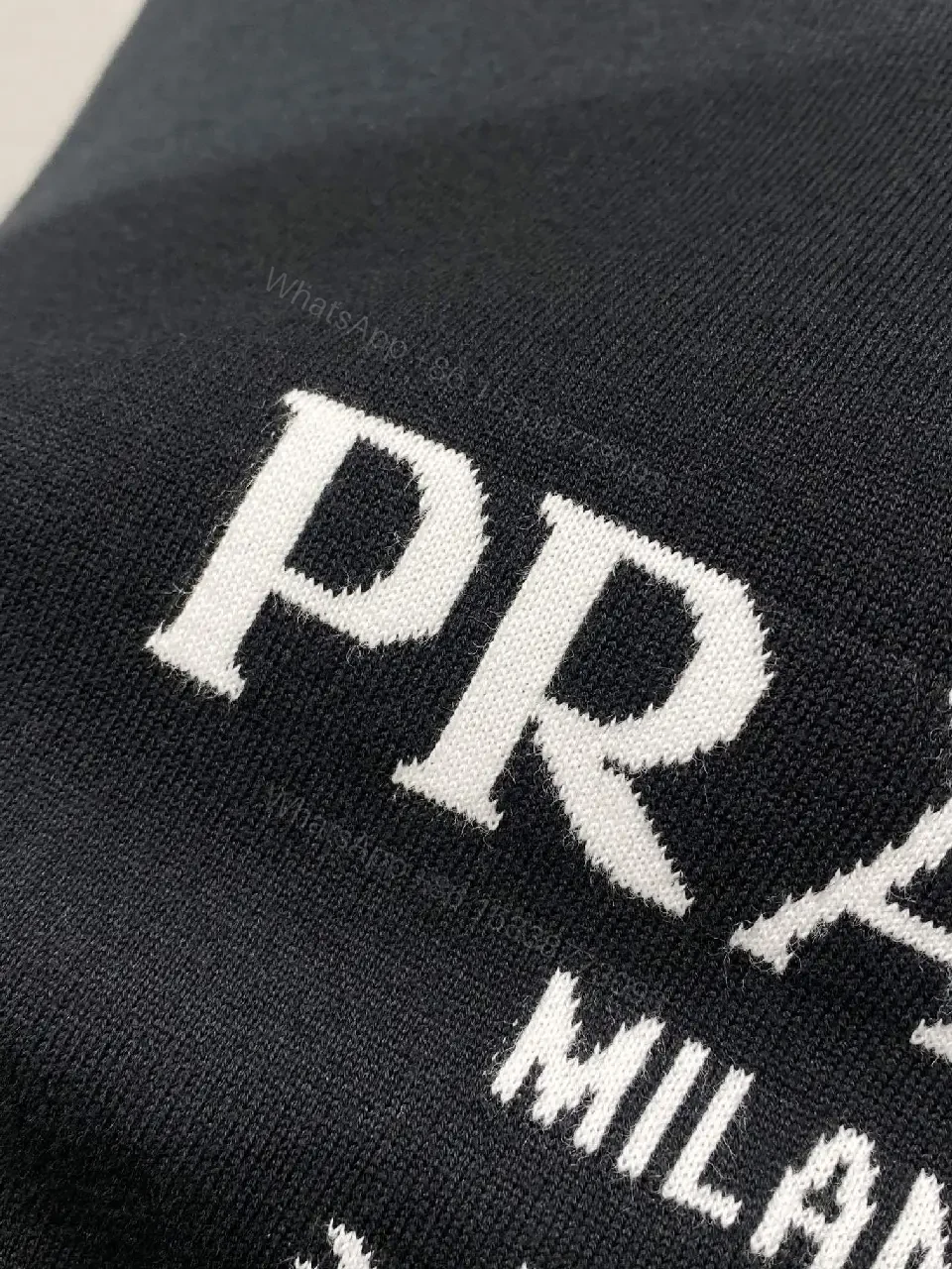View 7 of Minimalist Cotton Tee with Crest – Elevated Everyday Essential