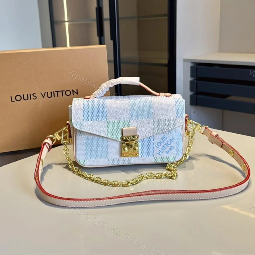 View 2 of Louis Vuitton Pochette Métis East West Damier Light Blue 21Cm N40749