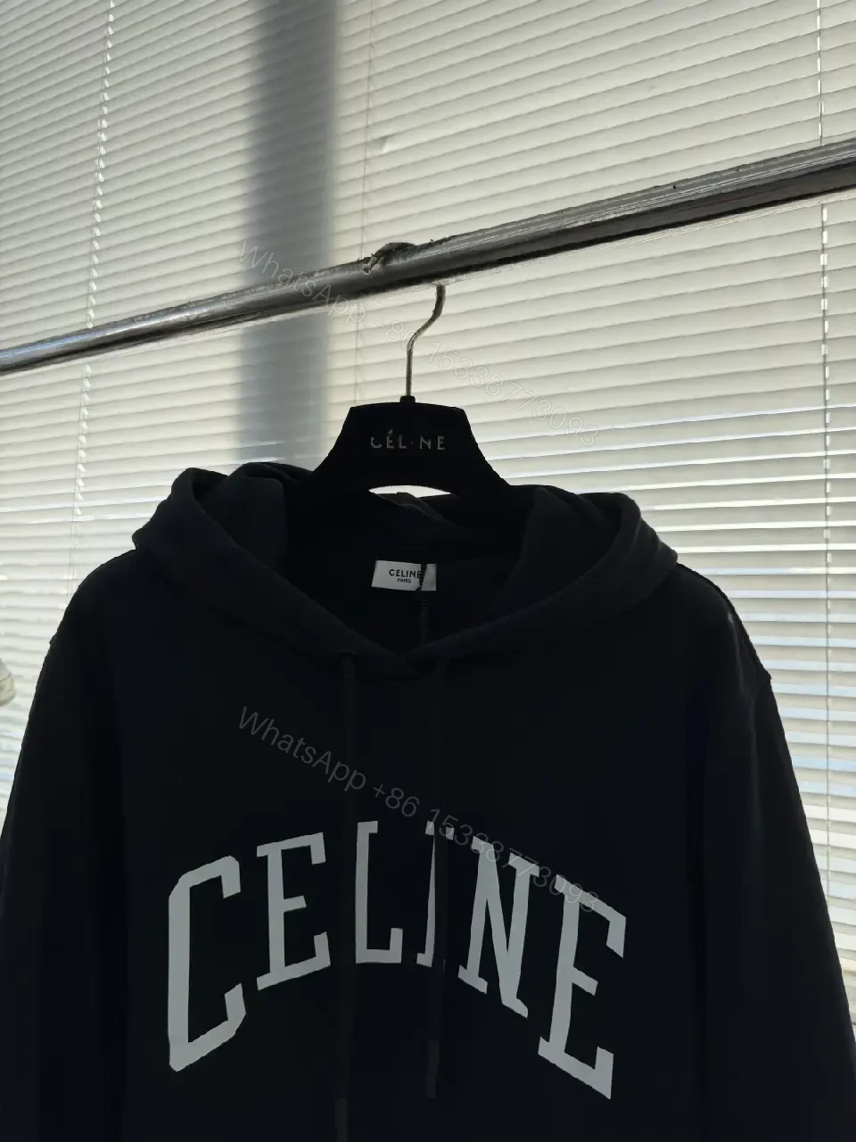 View 6 of Minimalist Logo Hoodie: Black Knit, Relaxed Streetwear Comfort