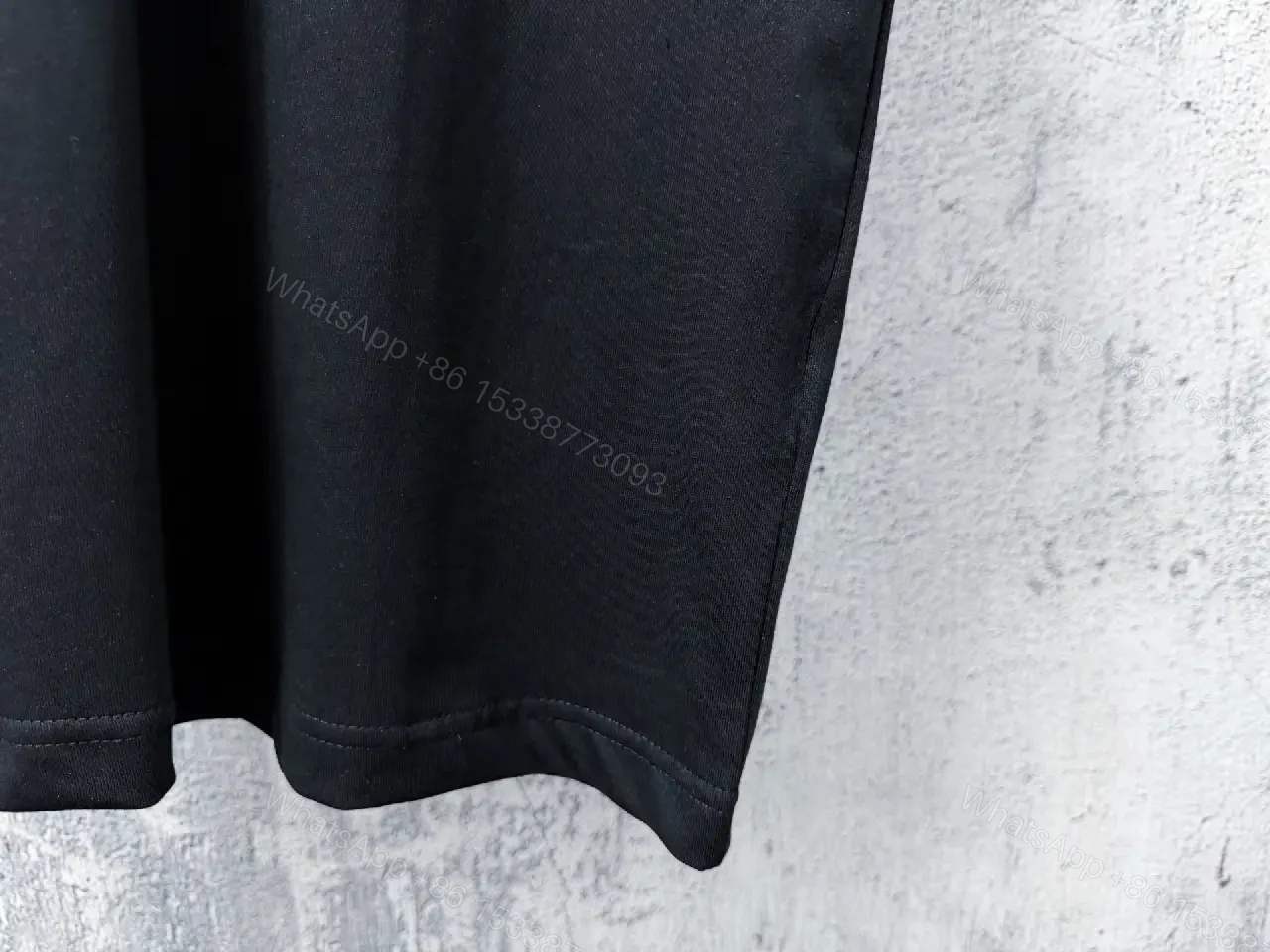 View 4 of Black Knit Tee, Subtle Logo, Oversized Comfort + Luxury Finish