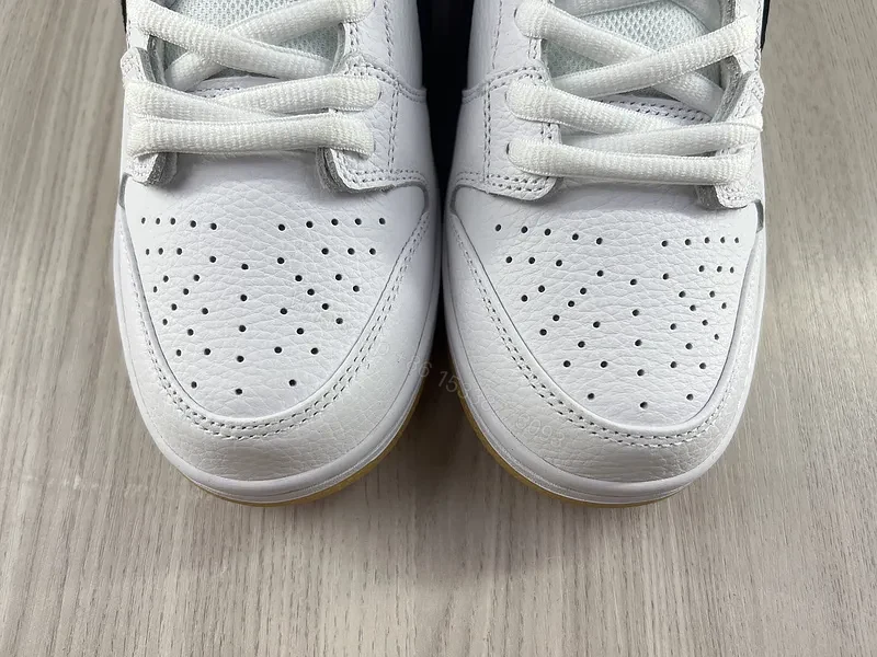 View 10 of Minimal White & Black Nike-Style Sneaker with Gum Sole