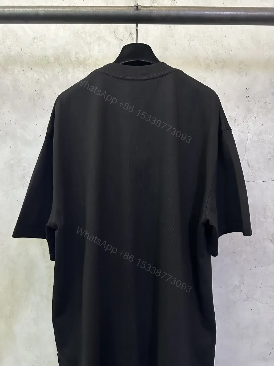 View 10 of Oversized Black Logo Cotton Tee – Modern Streetwear Essential