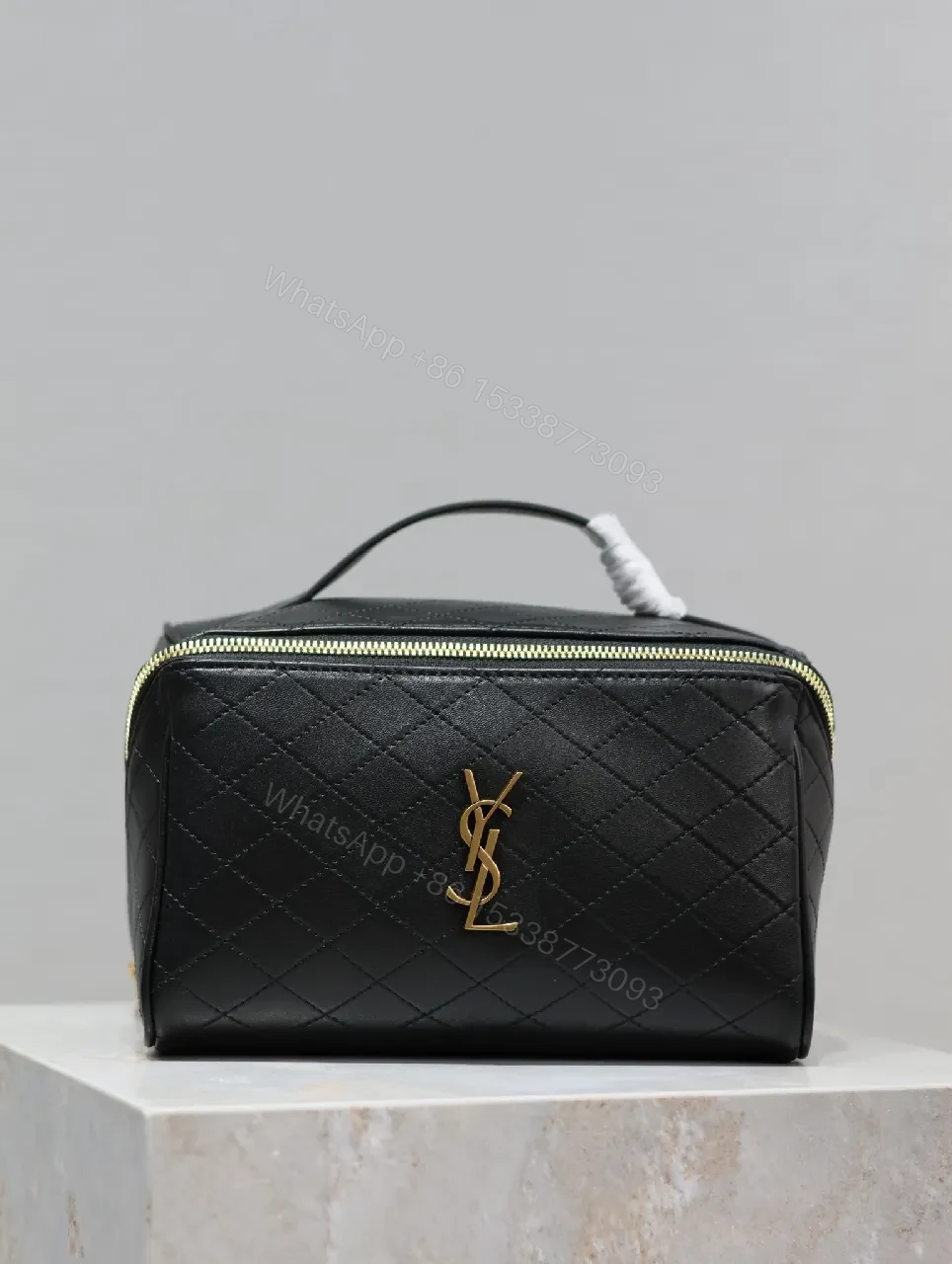 Compact Black Quilted Leather Vanity Bag with Gold Monogram — view 1