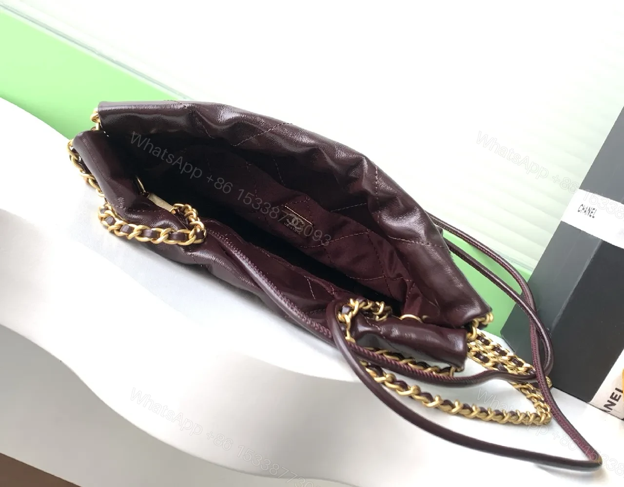 View 9 of Gold-Traced Quilted Bucket Bag: Luxury Leather, Iconic Hardware