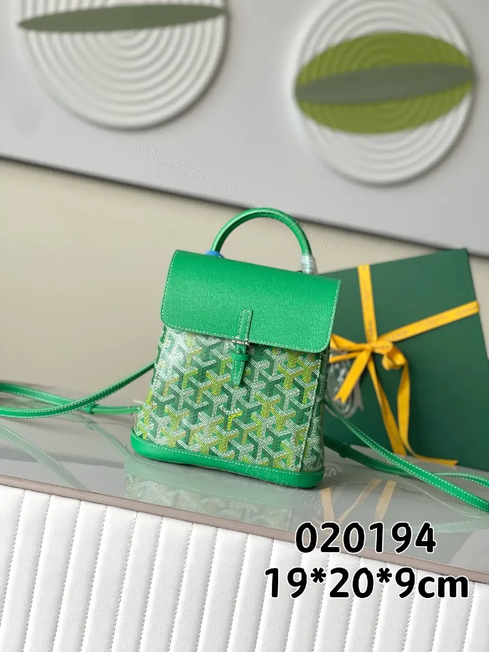 View 8 of green leather mini backpack with monogram pattern and luxury green trim for everyday use