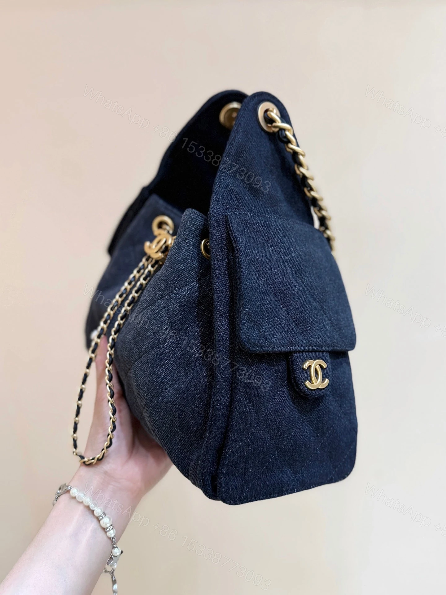 View 3 of CHANEL 25 HANDBAG 30 IN DARK BLUE DENIM GOLD HARDWARE