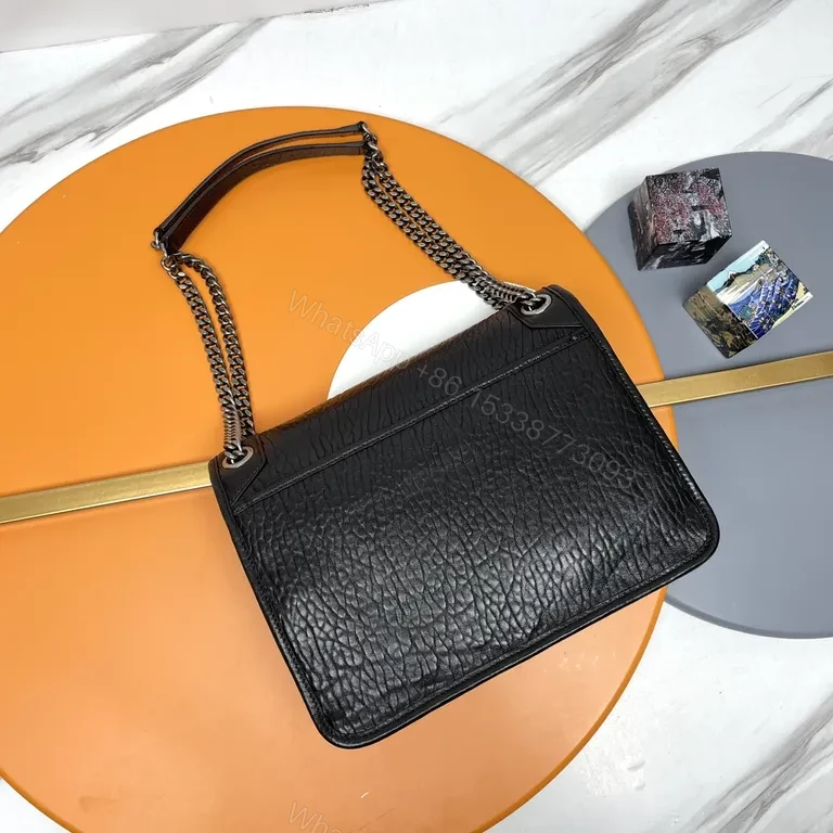 View 6 of Pebbled Leather Shoulder Bag â€“ Compact Luxury with Signature Hardware