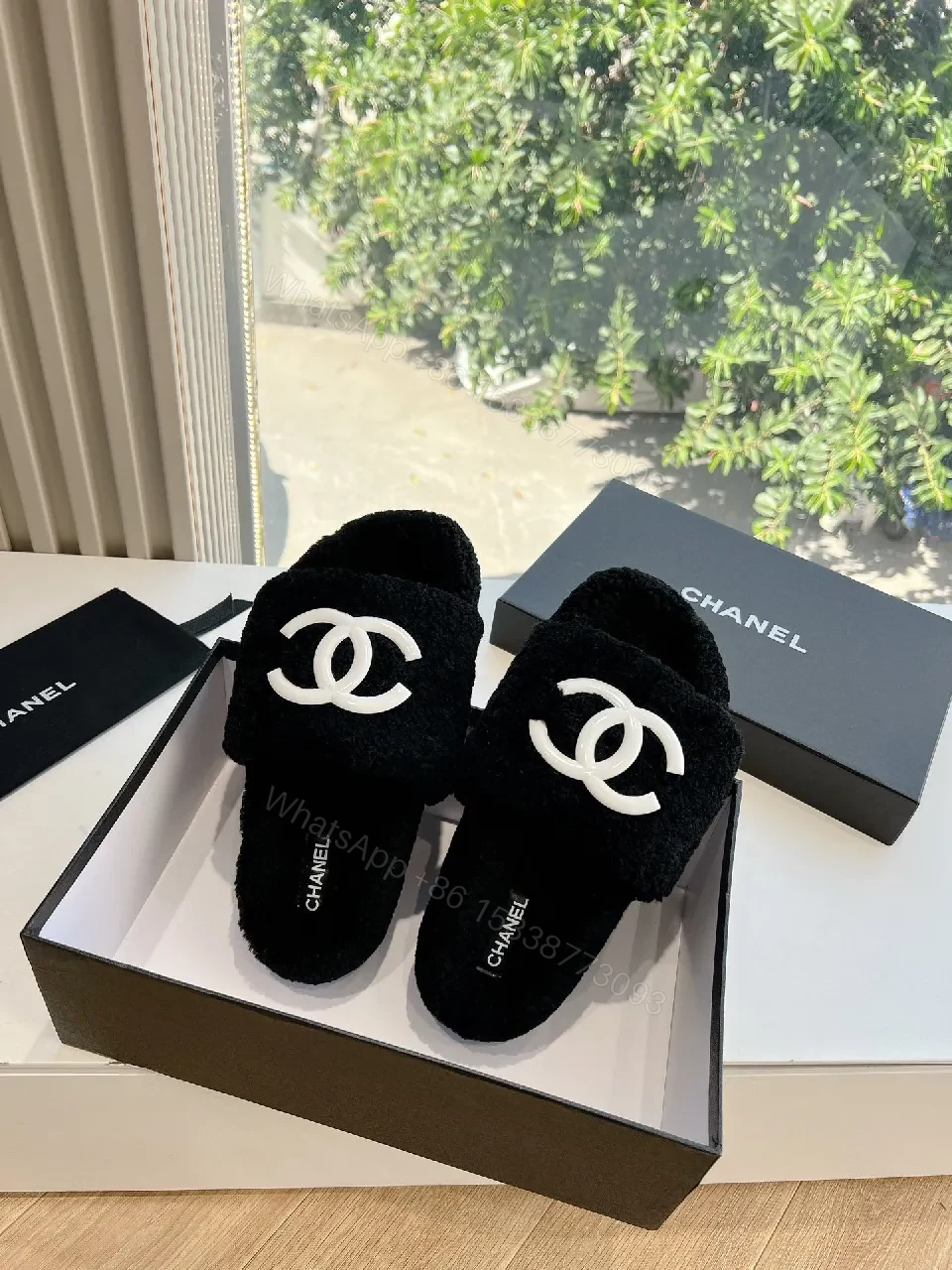 View 4 of Cozy Black Plush Slippers with Logo Detail