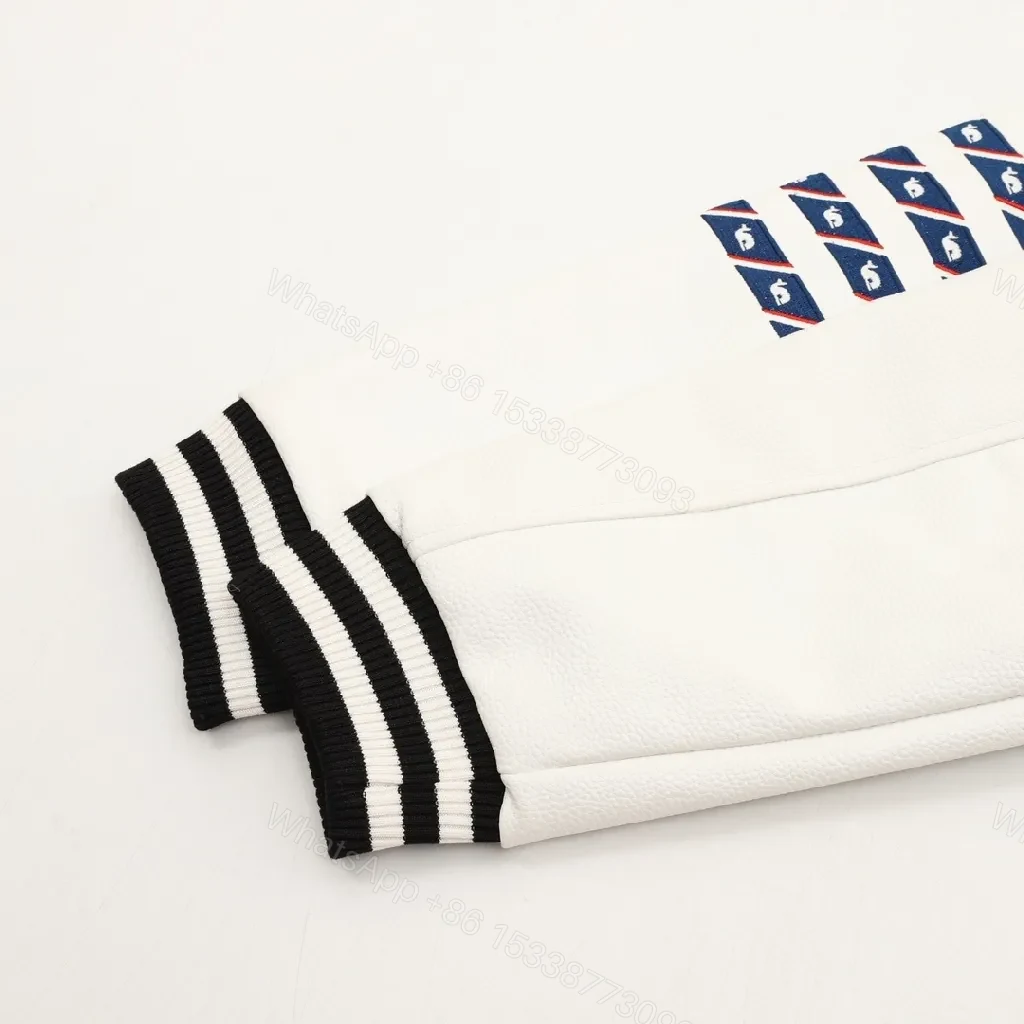 View 4 of Bold Black & Off-White Varsity Jacket with Embroidered Graffiti Details