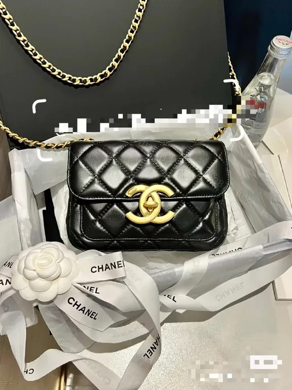 Quilted Black Leather Flap Bag with Gold Logo Charm — view 1