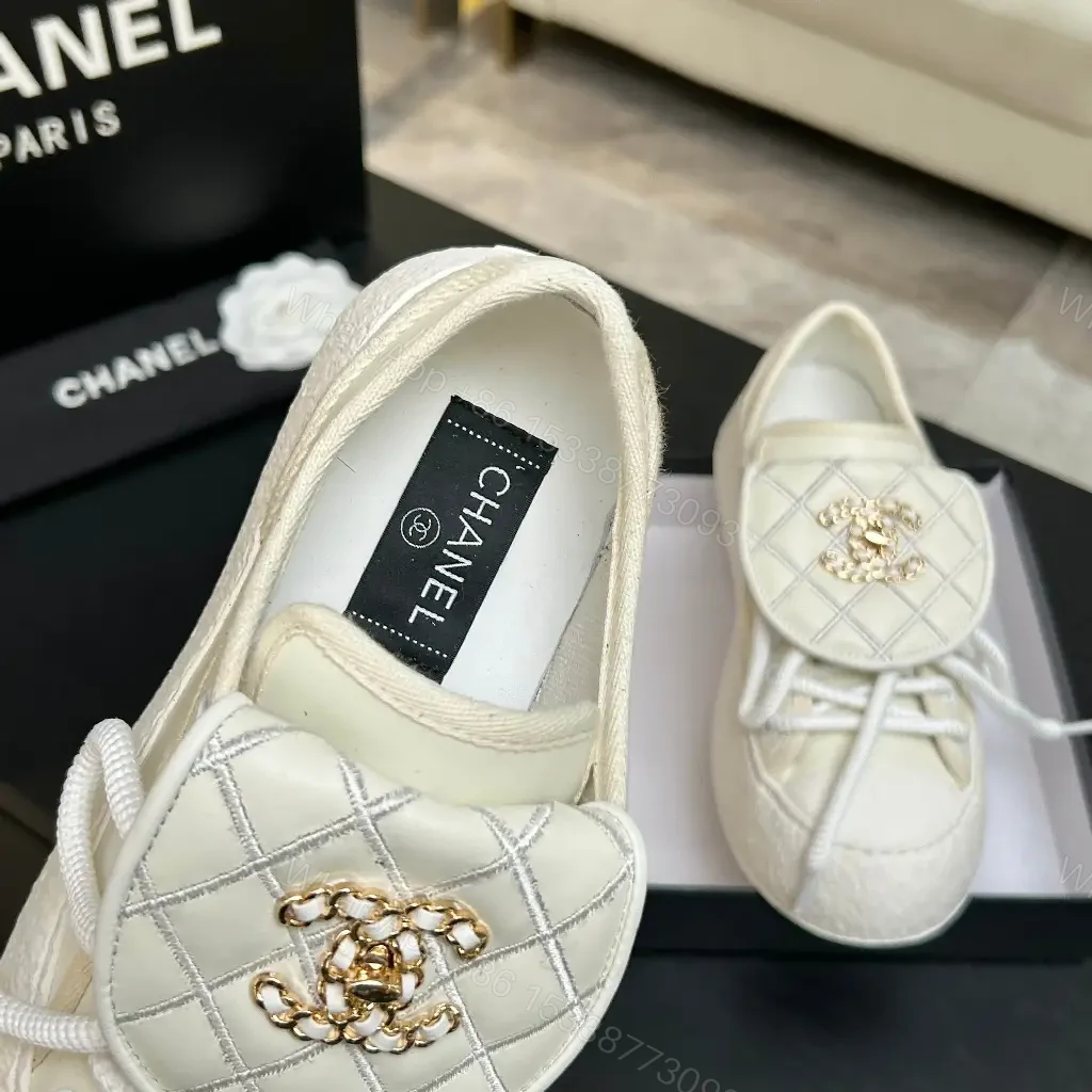 View 4 of Quilted Leather Slip-On Sneakers with Crest Embroidery