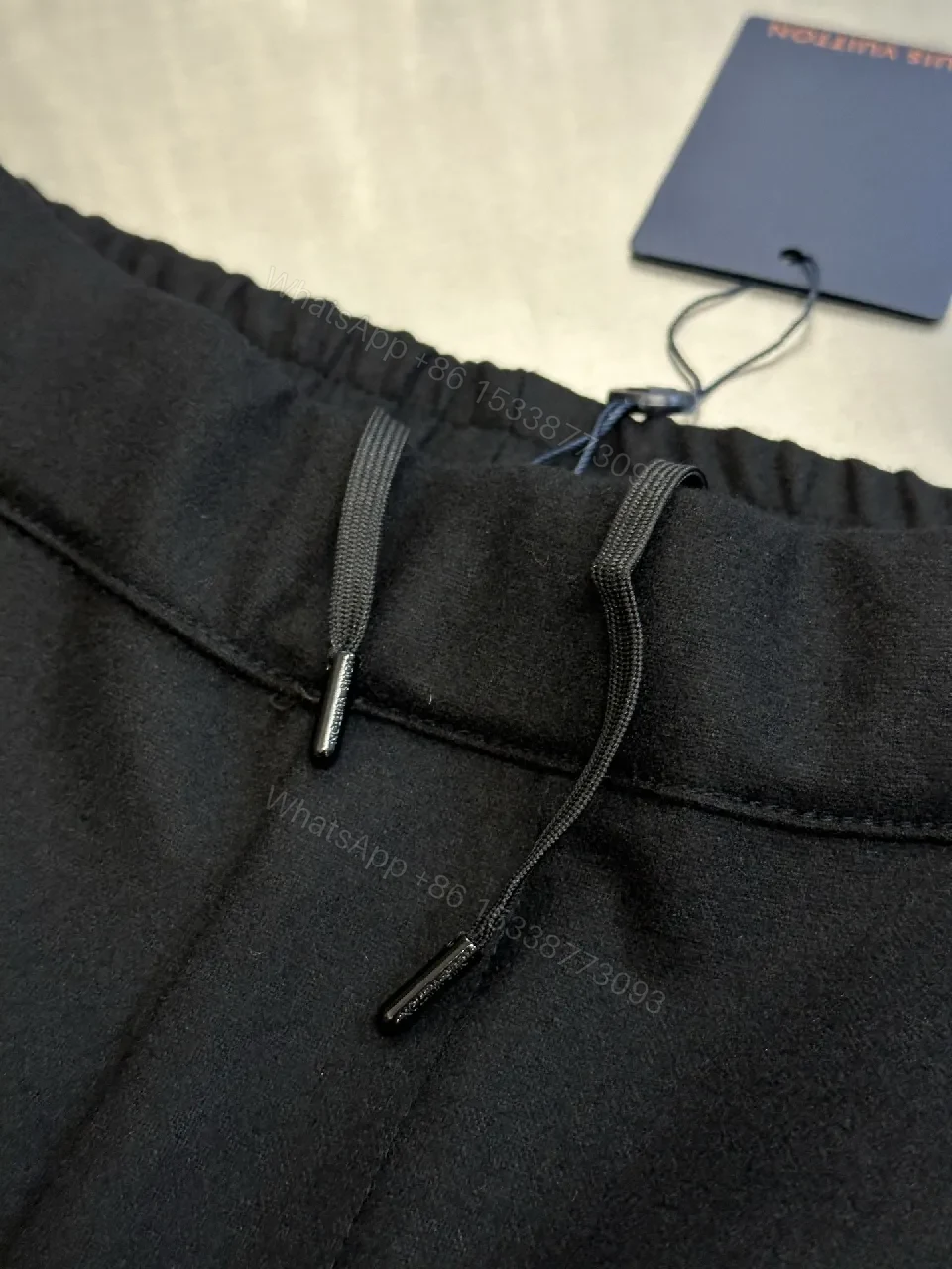 View 2 of Minimalist Tailored Trousers: Subtle LV Monogram Detail