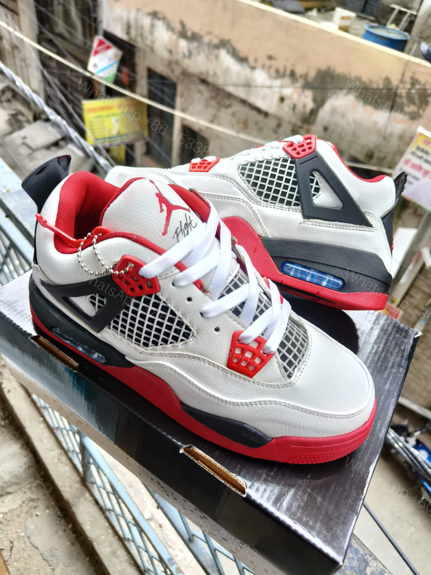 View 5 of BUY FIRST COPY NIKE JORDAN 4 “RED/WHITE” SNEAKERS