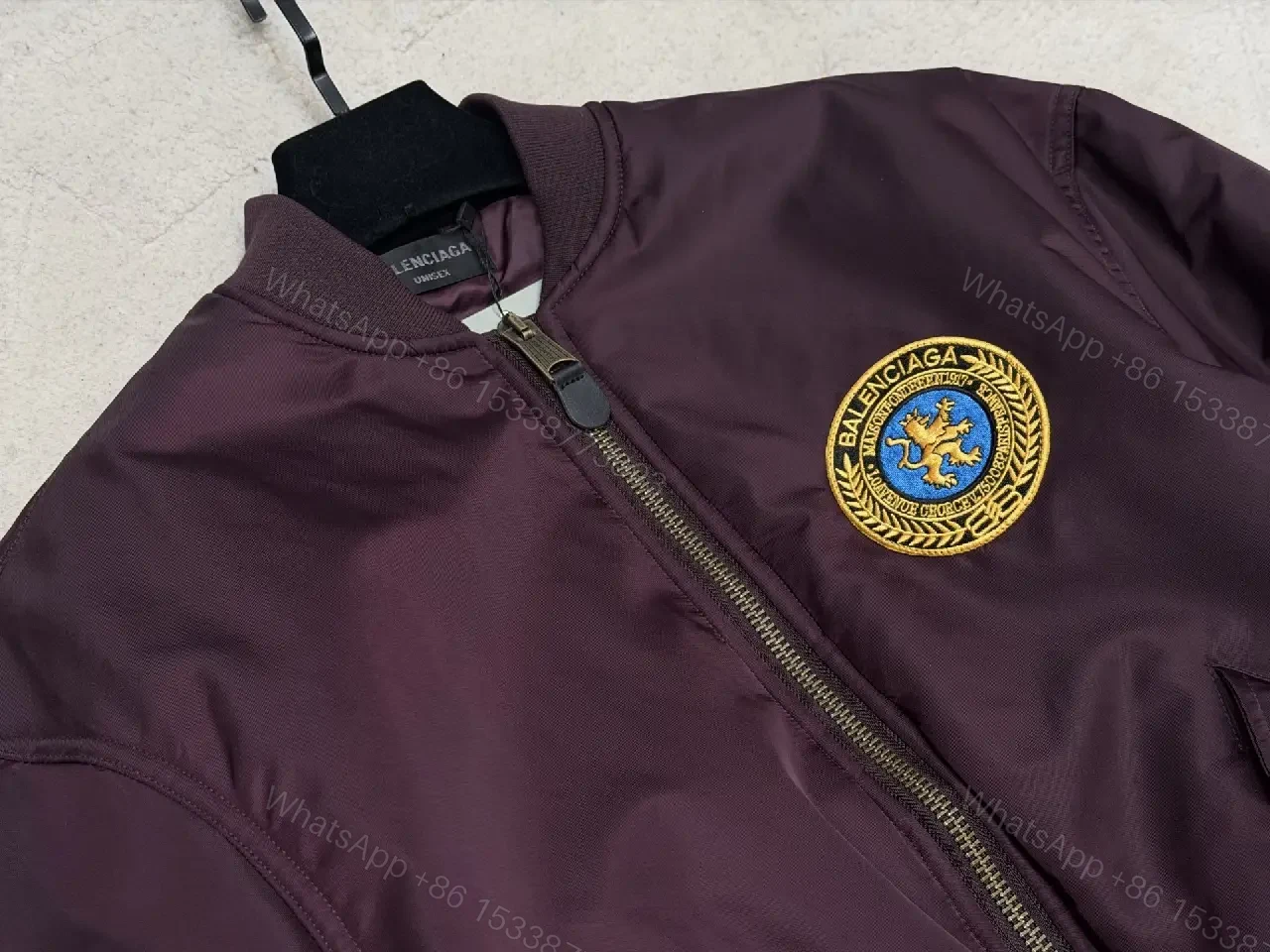 View 3 of Burgundy Satin Bomber with Crest Patch — Luxe Everyday Outerwear