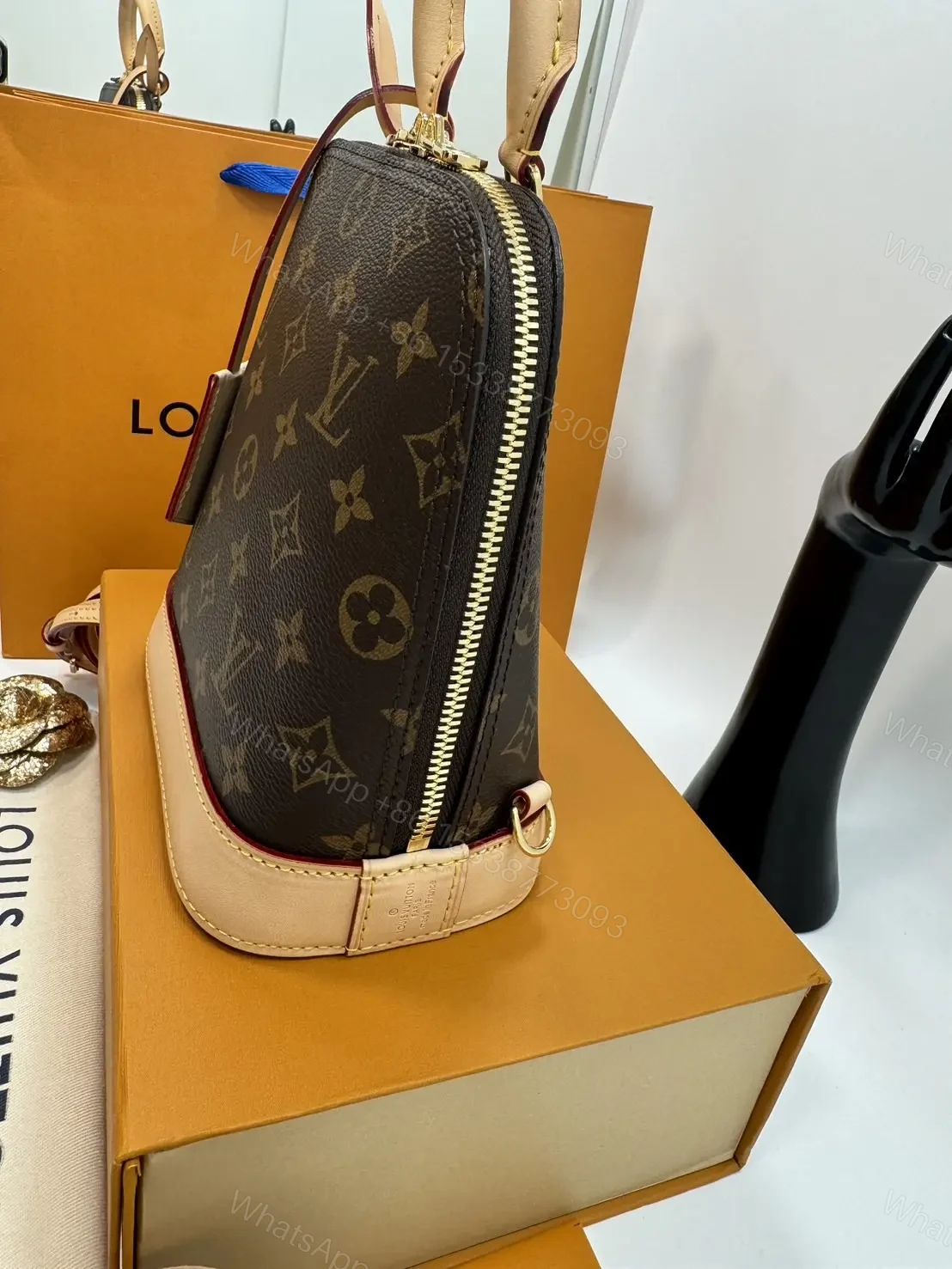 View 7 of Louis Vuitton Alma backpack in the signature brown monogram canvas