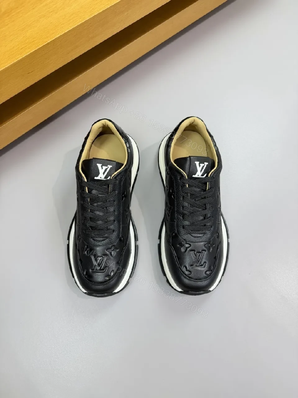 View 4 of Black Leather Trainer with Subtle Monogram Detailing - Everyday Luxe Comfort