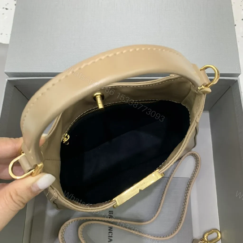 View 5 of Compact Taupe Leather Handbag with Gold Hardware, Crossbody Ready