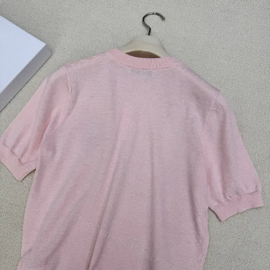 View 6 of Soft Pink Knit Top with Crest – Elegant Everyday Essential