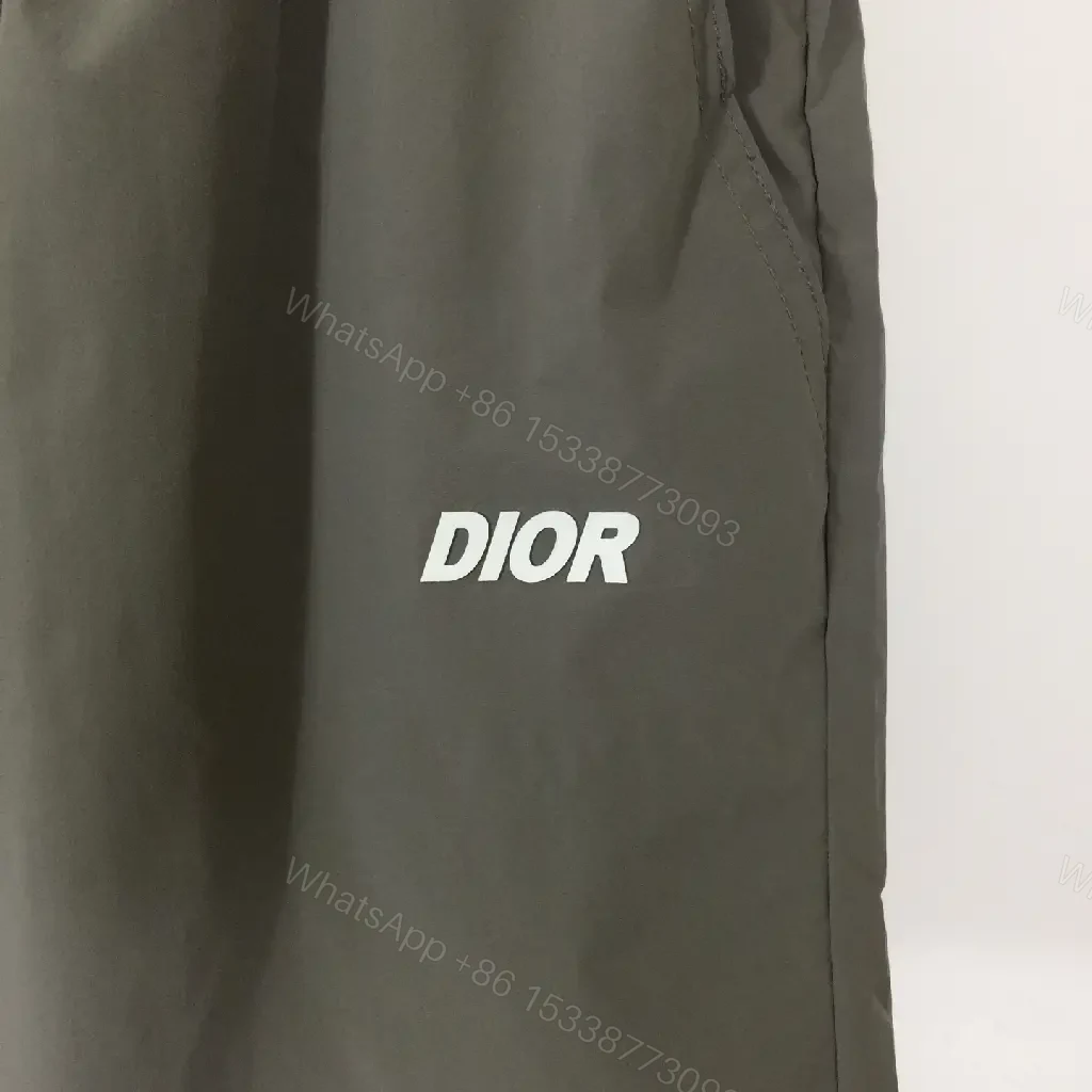 View 3 of Gray Nylon Bermuda Shorts Dior Logo Clip Hem Trim