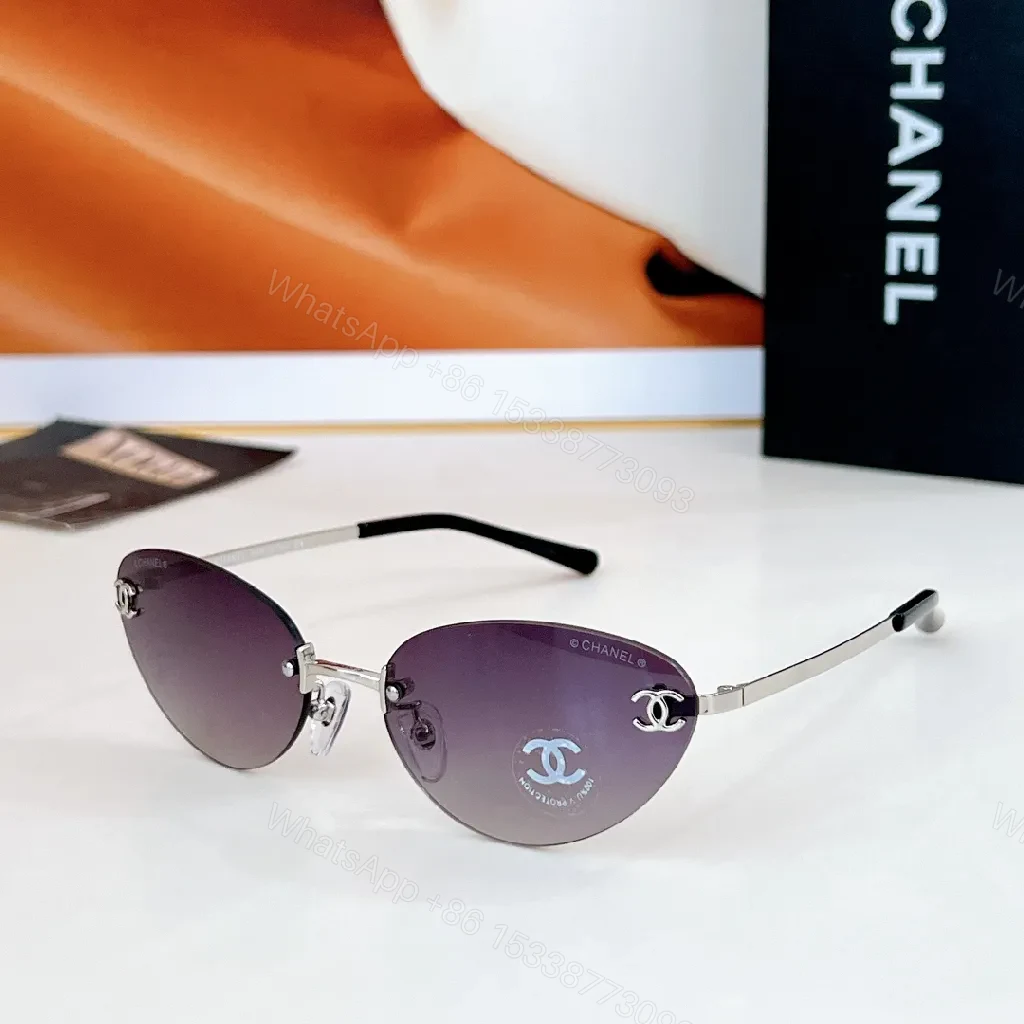 View 5 of Rimless Blue Lens Sunglasses with Gold-Tone Frames