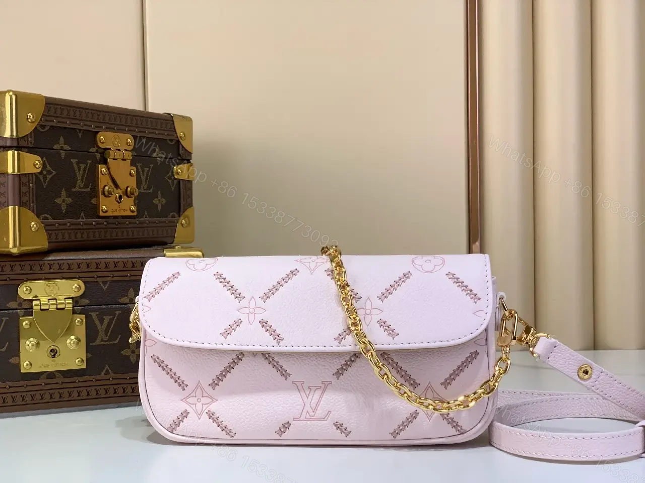 View 9 of Light Pink Pebbled Leather Shoulder Bag with LV Monogram Pattern