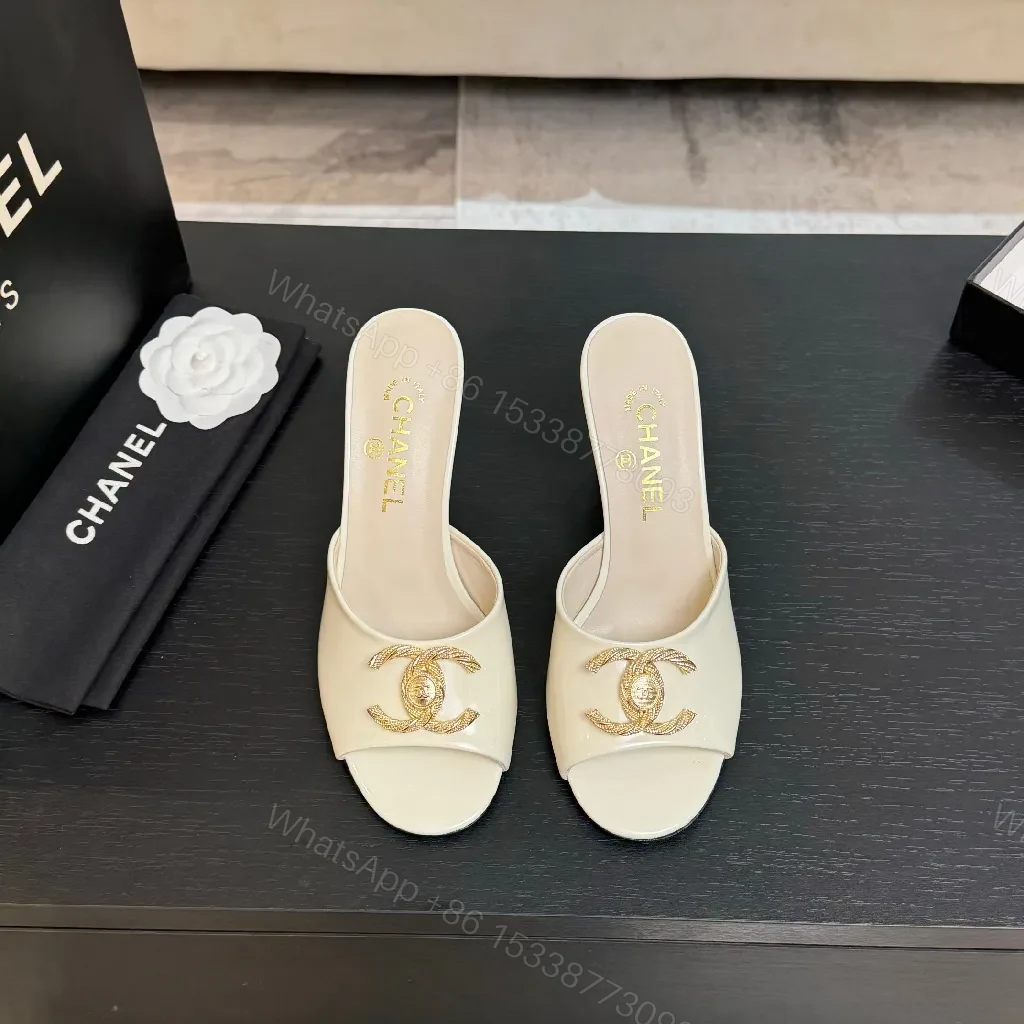View 2 of White Patent Mules with Gold Logo Embellishment – Sleek Luxury Footwear