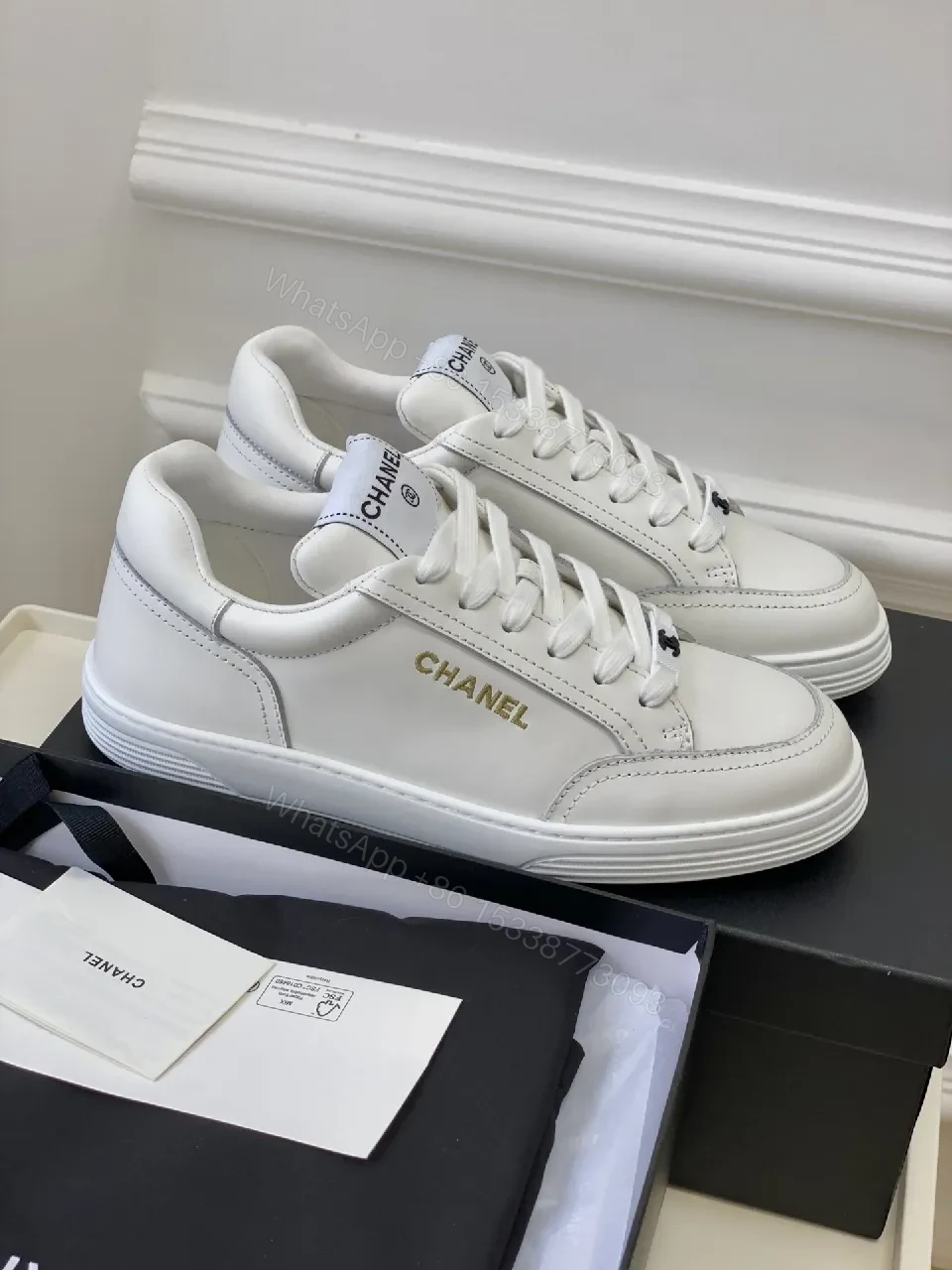 View 6 of White Leather Sneakers: Minimalist High-Tops with Gold Logo