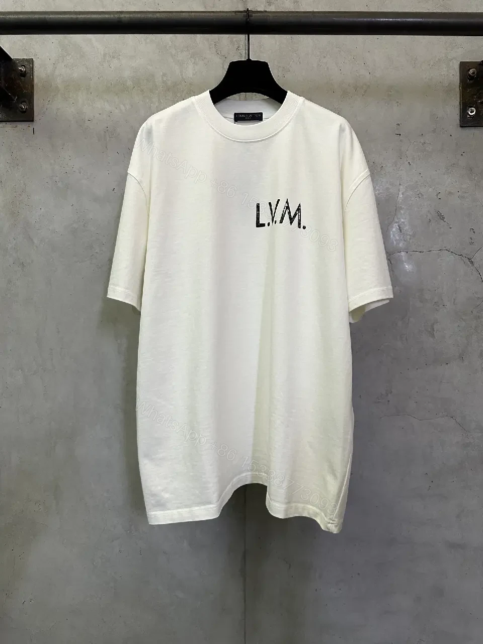View 9 of Minimalist White Tee with Subtle LV.M. Marking — Premium Everyday Wear