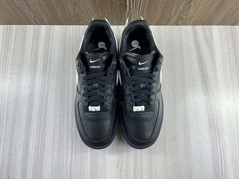 View 8 of Black Leather Low-Top Sneakers with White Swoosh - Luxury Streetwear