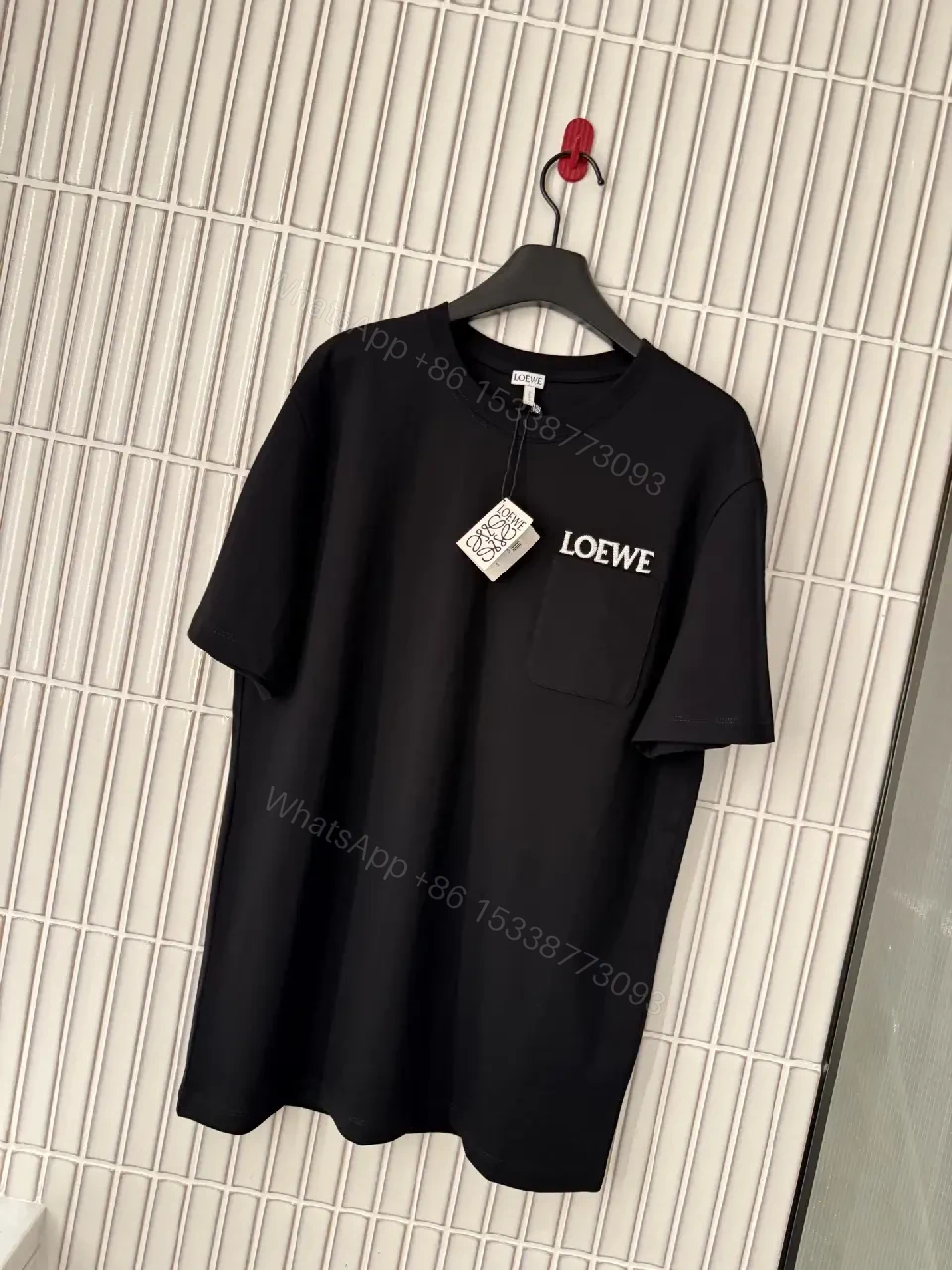 Black Cotton Crew Tee with Pocket – Subtle Luxe Comfort — view 1