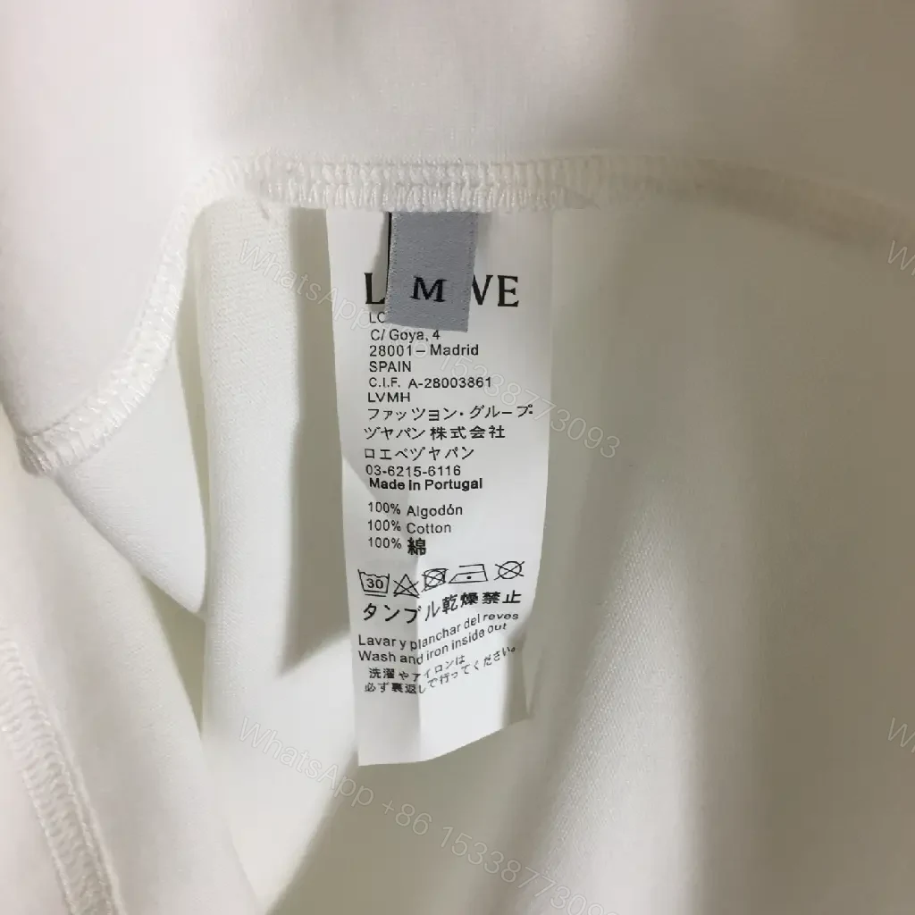 View 3 of Minimalist White Tee with Signature Accents—Premium Cotton-jersey Tee