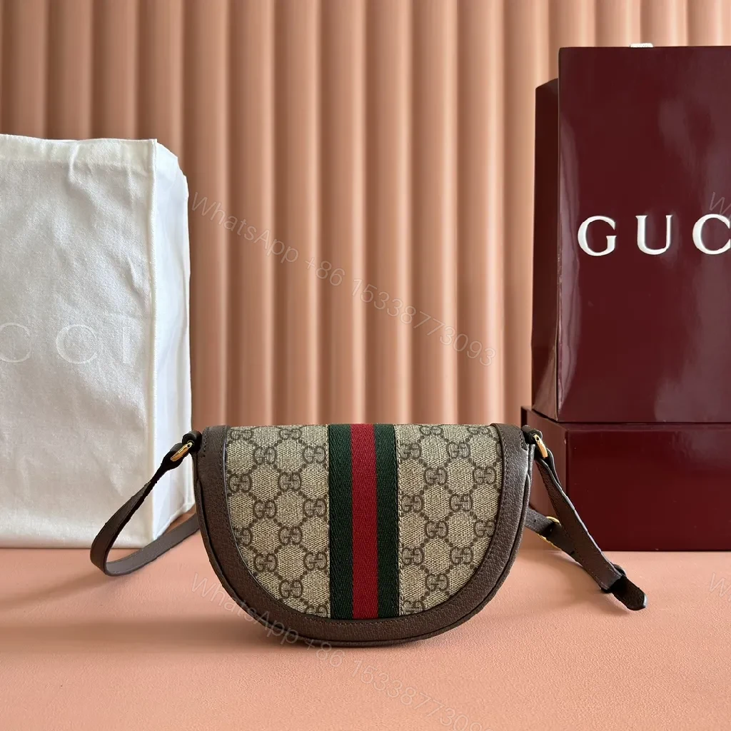 View 9 of Green Canvas Saddle Bag: Luxe Crossbody with Web Stripe and Gold Hardware