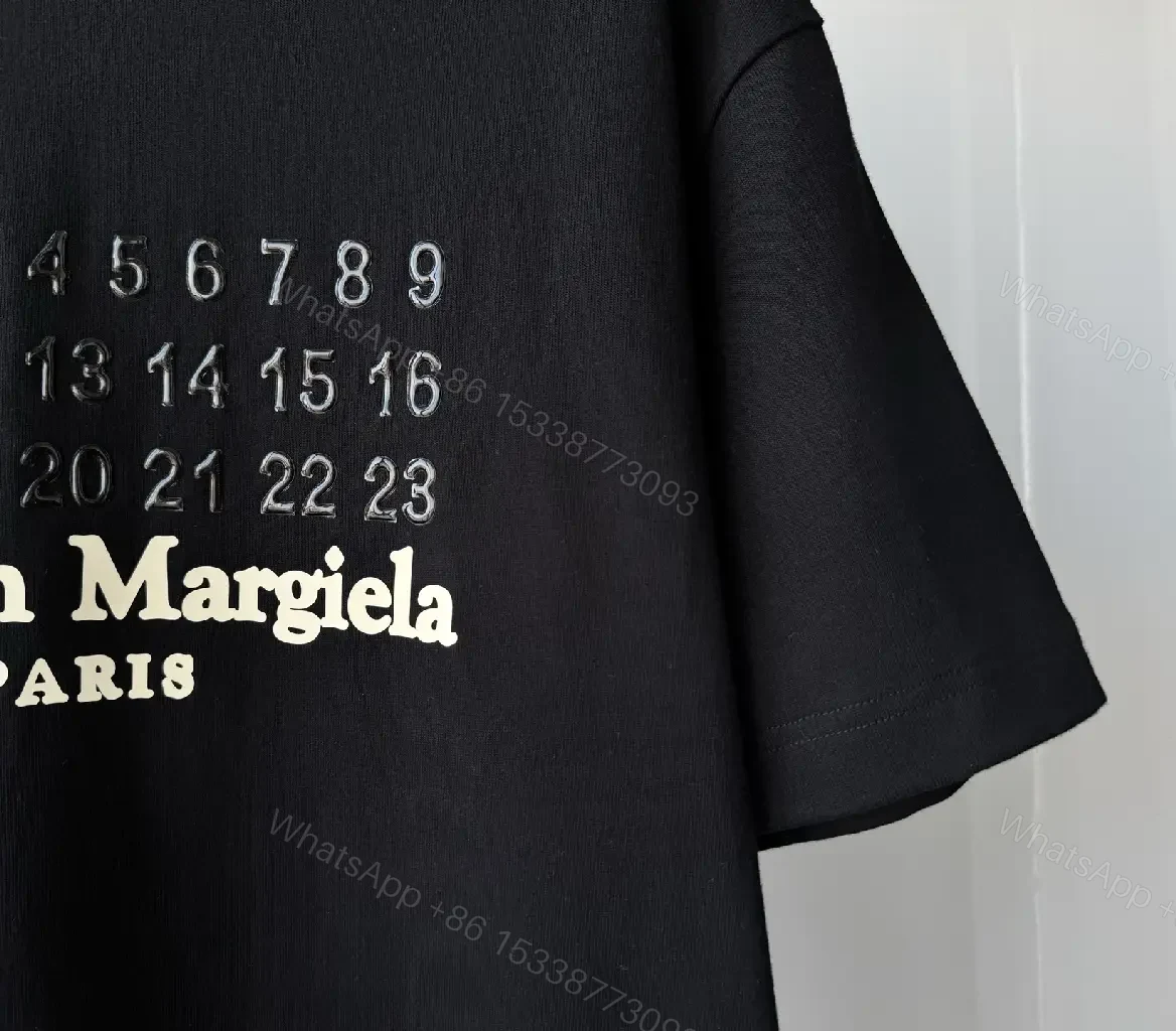 View 9 of Oversized Black Tee with Embossed Numeric Grid - Modern Graphic Comfort