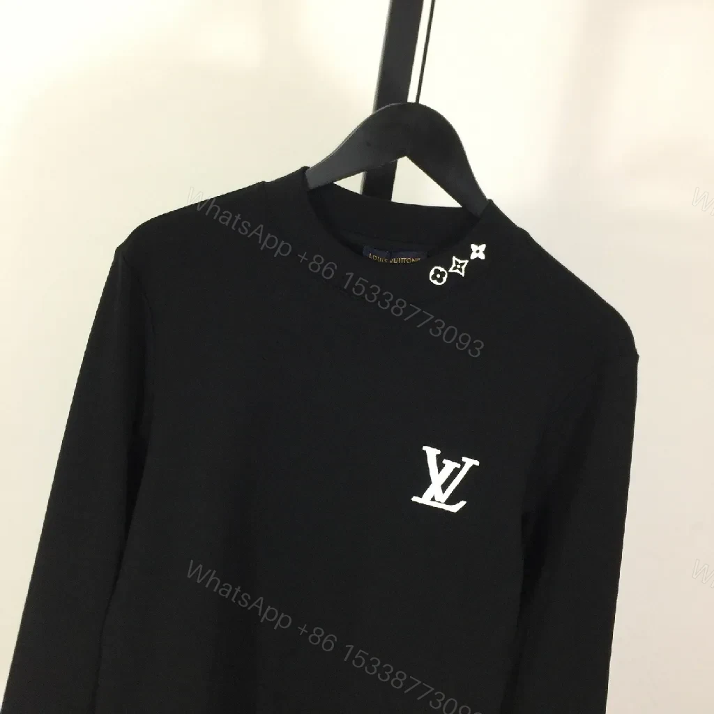 View 3 of Minimalist Black Sweatshirt with Subtle Monogram Accent