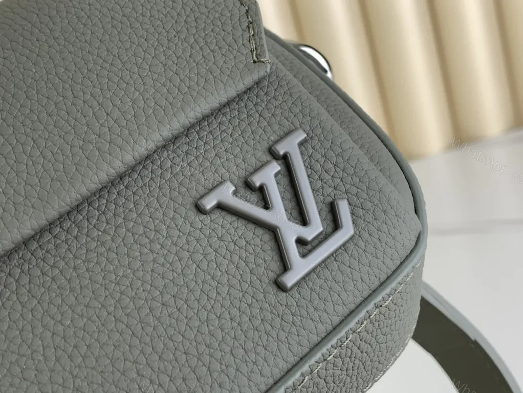 View 7 of Quiet Luxe Compact Crossbody: Pebbled Leather, LV Logo, Gold Hardware