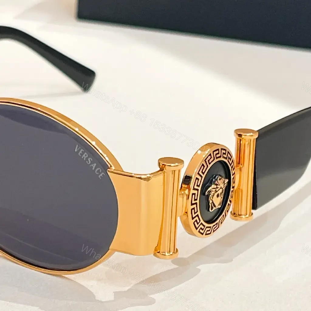 View 4 of Amber-Tinted Round Sunglasses: Gold-Accent, Sculpted Hardware, UV400 Shield