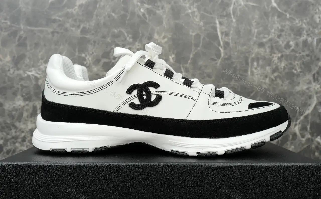 View 2 of White Leather Chunky Sneaker with Chanel Logo Details