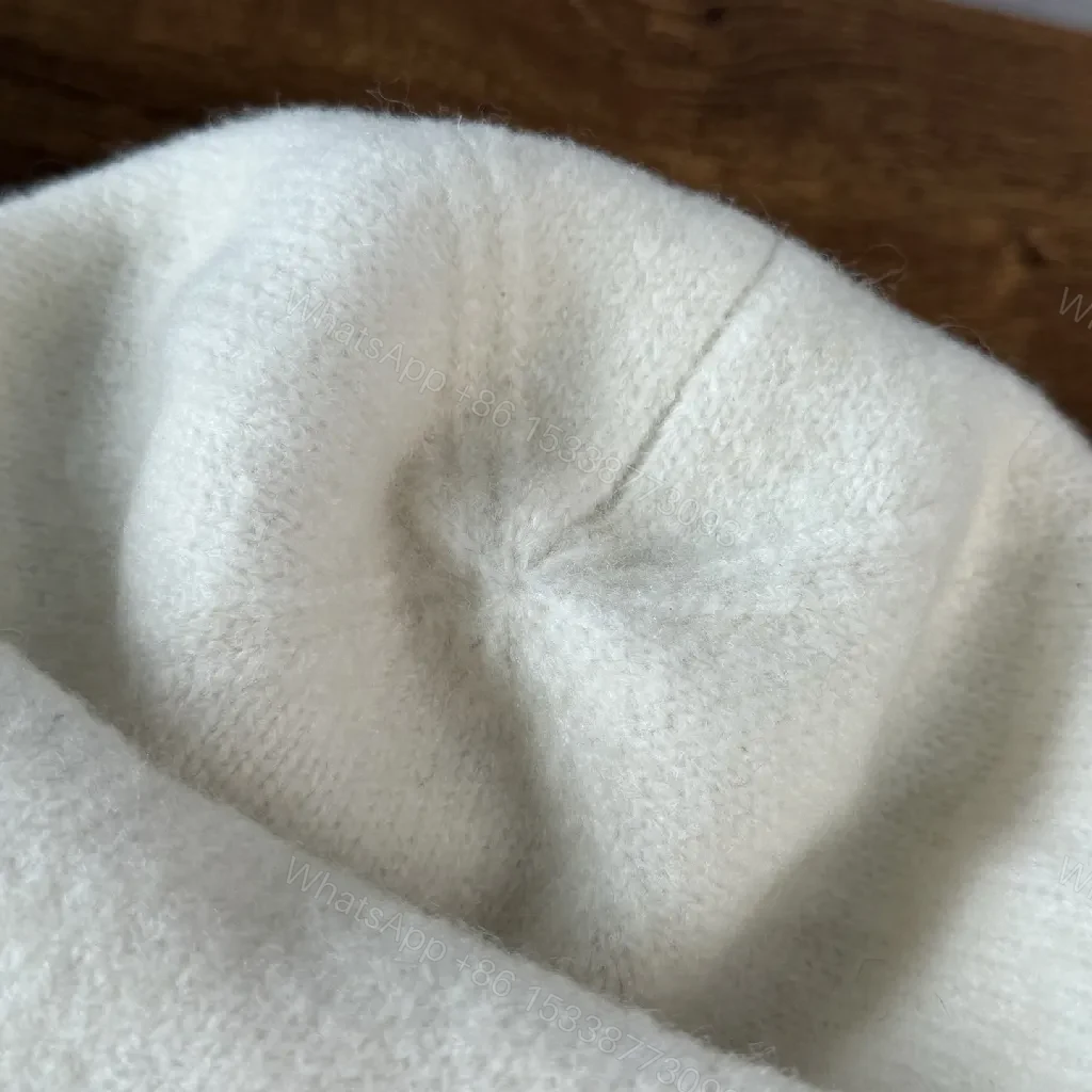 View 8 of Chic Minimalism Beanie: Off-White Knit, Embroidered Logo, Everyday Luxury