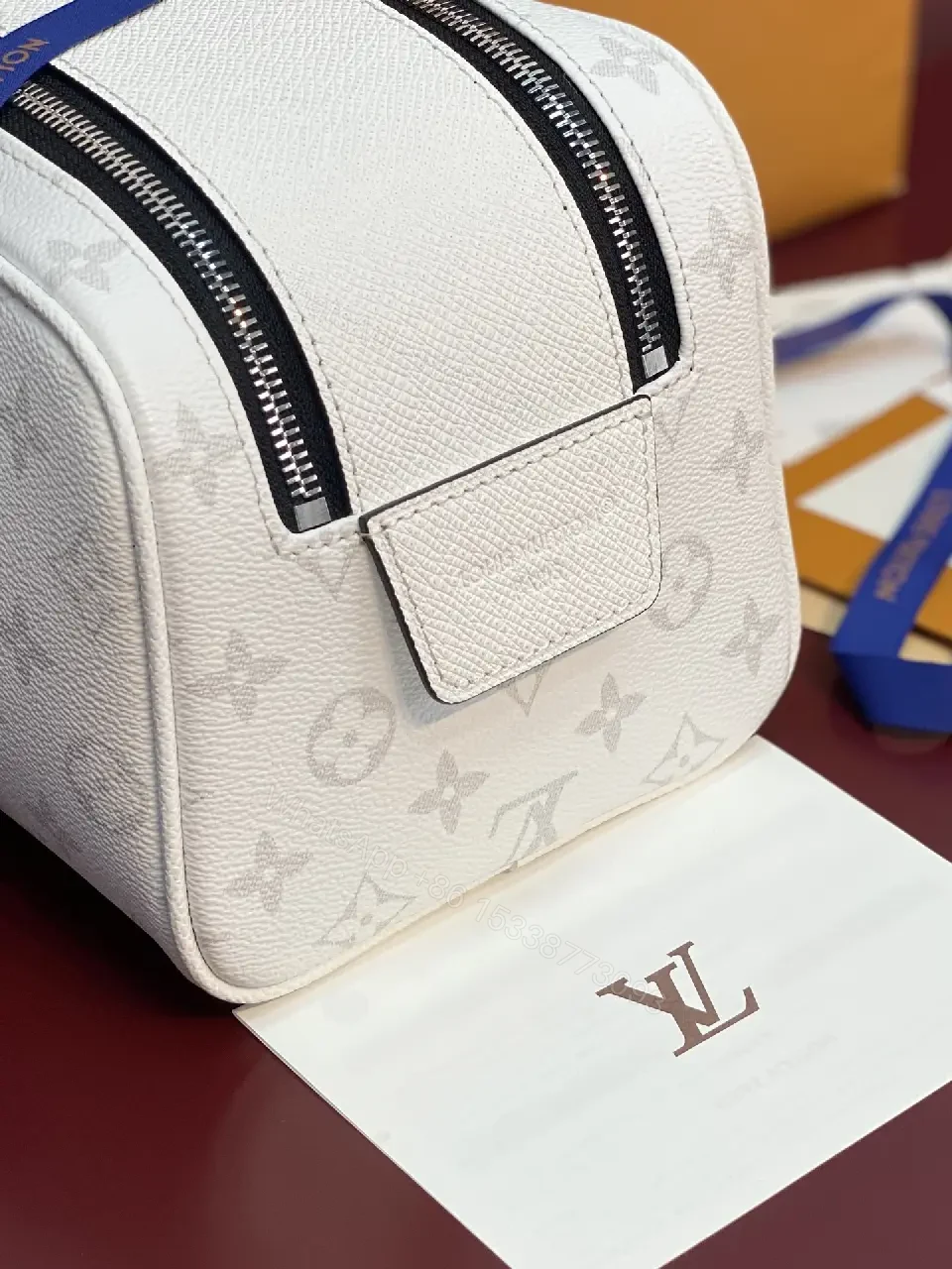 View 5 of White Leather Monogrammed Subtle LV-inspired Cosmetic Bag