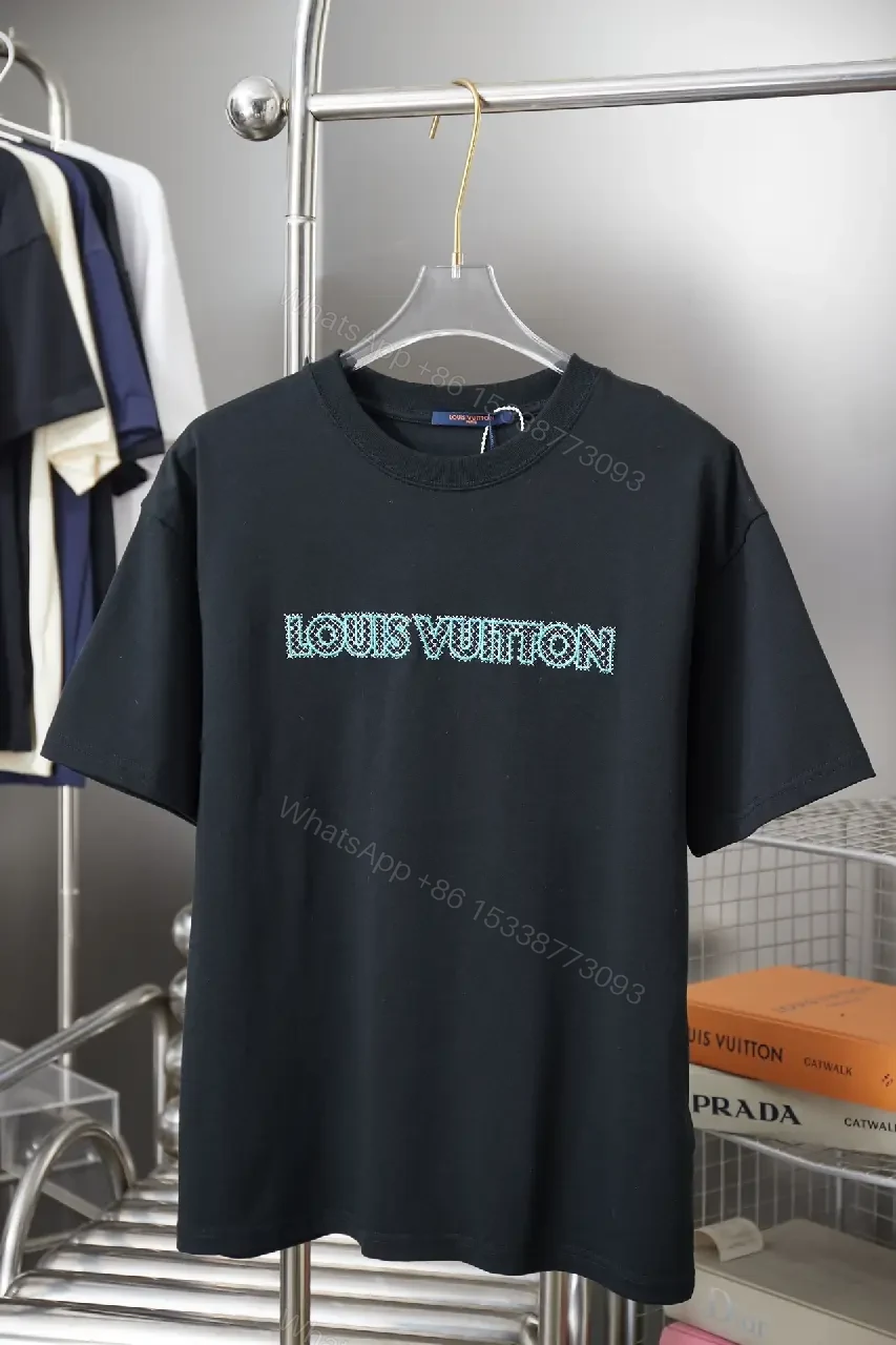 Black Cotton Tee with Teal Embroidered Logo Accent, Minimalist Style, Everyday Luxury Tee — view 1