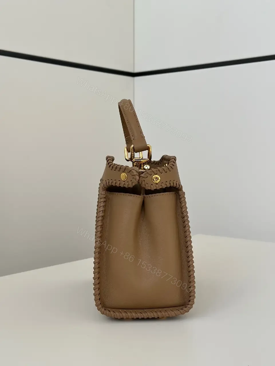 View 2 of Taupe-Tone Leather Crossbody: Braided Edge, Turn-Lock Bag