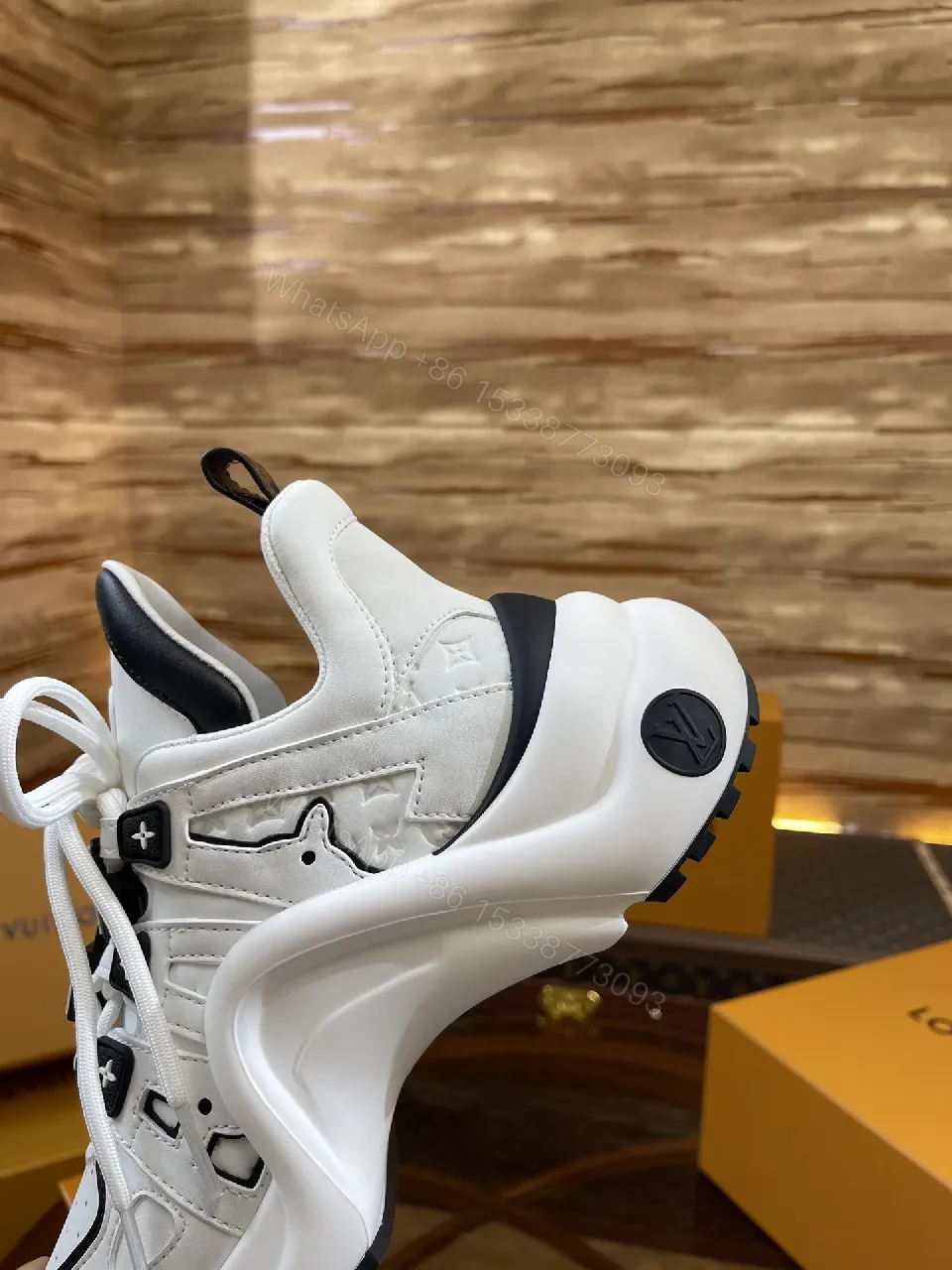 View 8 of Premium Leather High-Top Sneakers with LV Embellishments