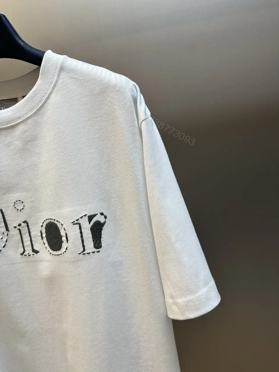 View 4 of Minimalist White Logo Tee - Premium Cotton, Modern Fit, Graphic Accent