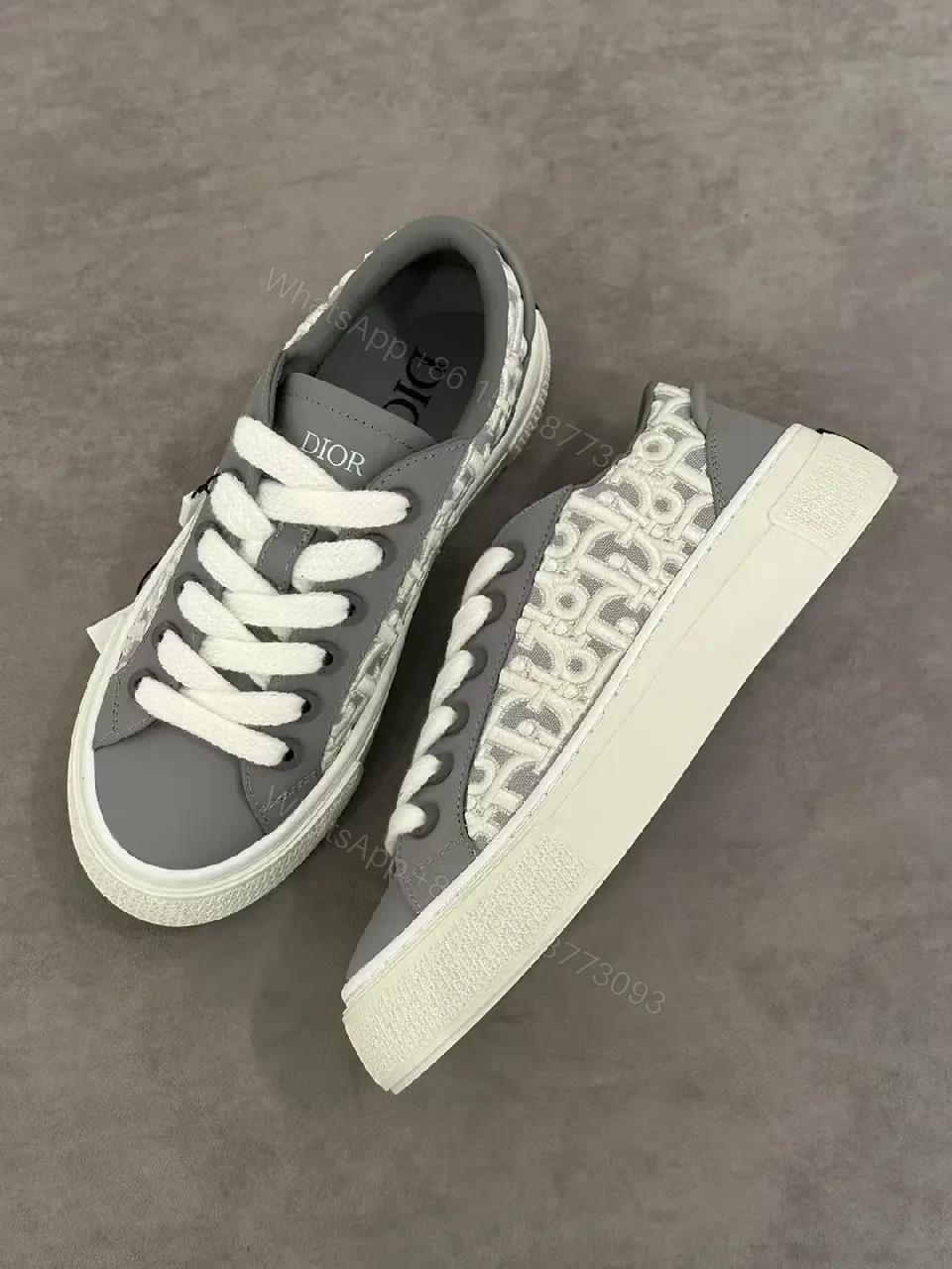 Gray Leather Sneaker with Monogram Pattern, Luxurious Texture, Casual High-Tops — view 1