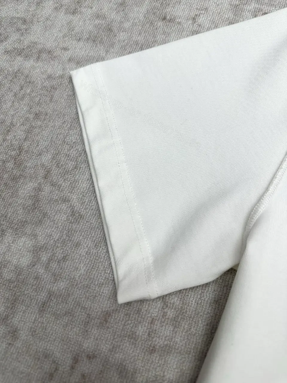 View 2 of Minimalist White Cotton Tee with Embossed Accent, Everyday Luxury