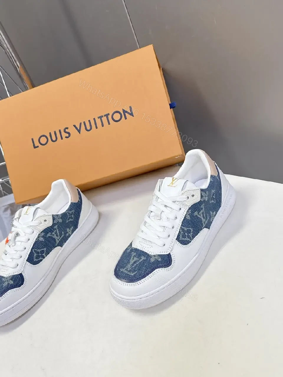 View 5 of Denim-Accent Luxury Sneakers with LV Flair
