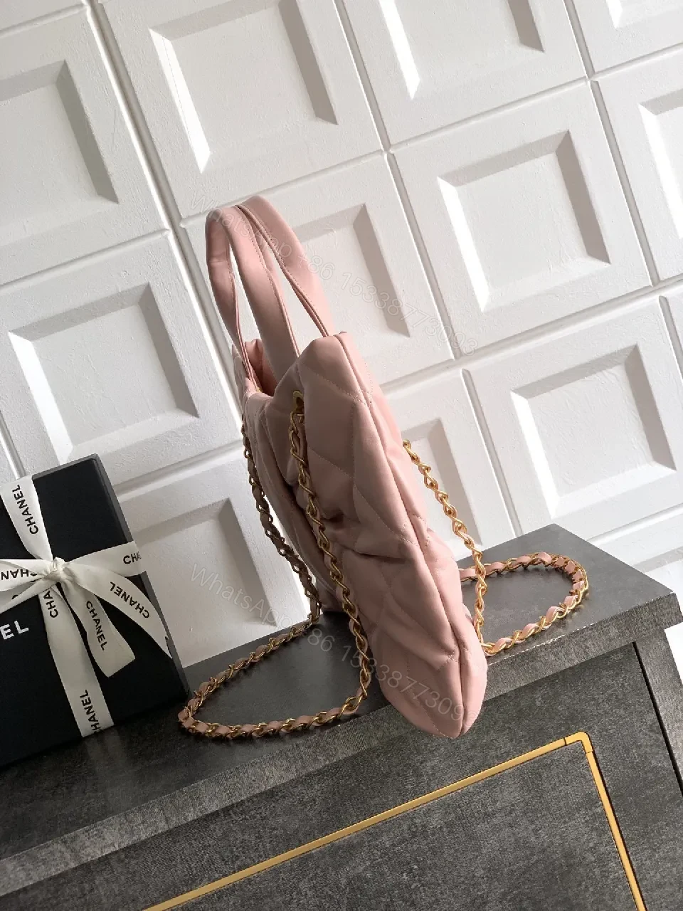 View 5 of Soft Pink Quilted Handbag with Gold Accents, Compact Luxury Tote