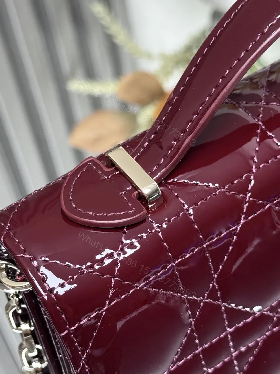 View 2 of Burgundy Patent Leather Clutch: Geometric Quilted Luxury