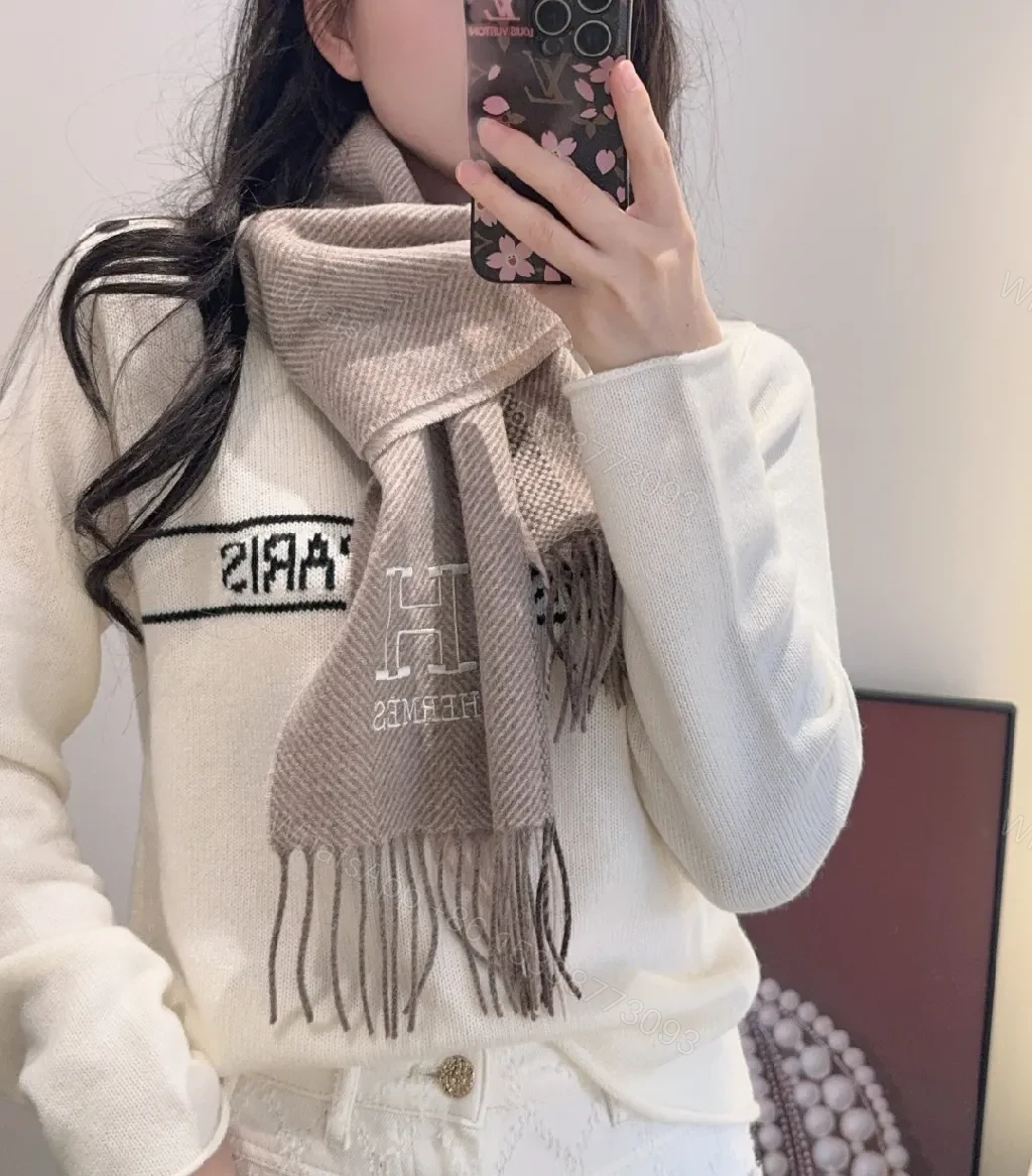 View 2 of Neutral Herringbone Knit Scarf with Subtle Emblem Detail